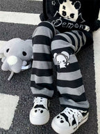Kawaii Black & Gray Striped Character Print Pants with Lace-Up Detail